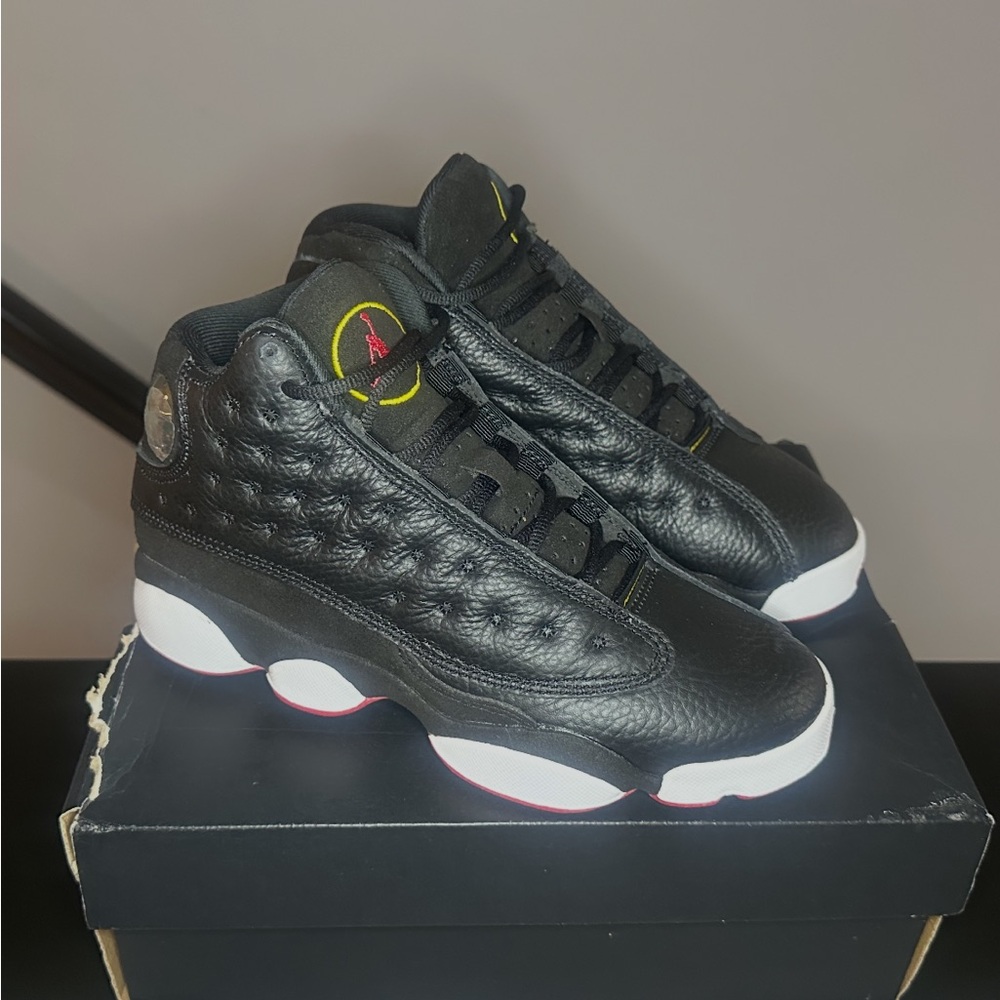 Air Jordan 13 Retro 'Playoff' basketball sneakers.
